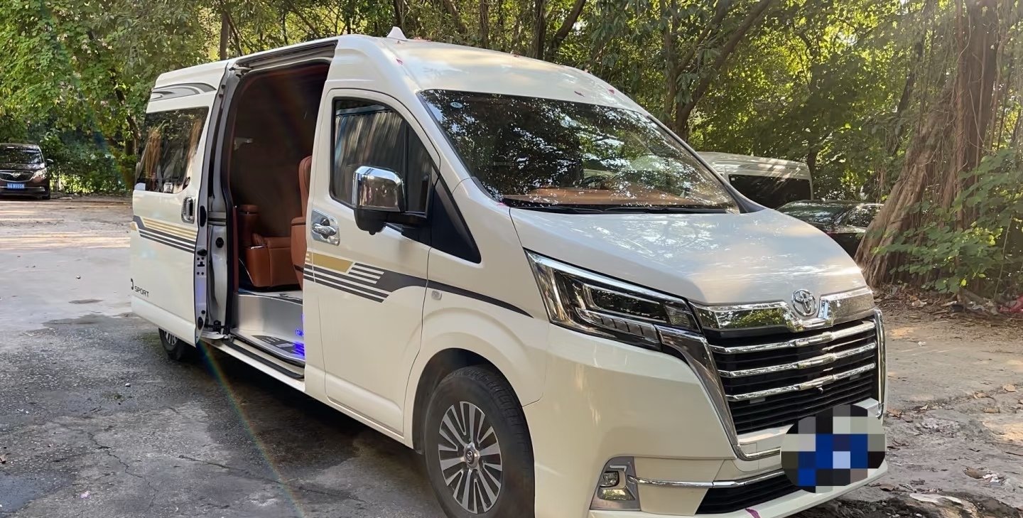 White Toyota Hiace exterior with sliding door open