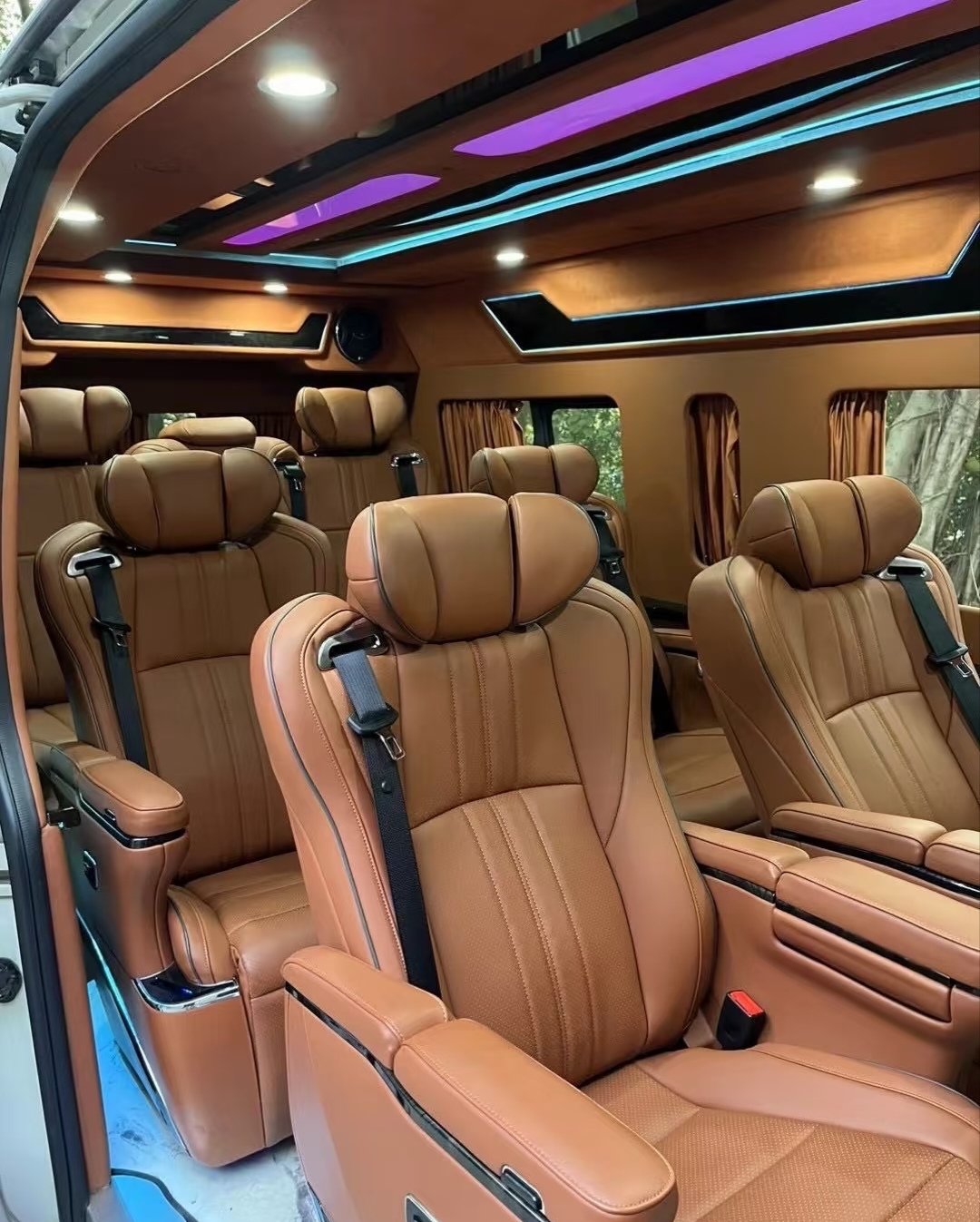 Brown Toyota Hiace passenger seats with contrasting piping and coordinated cabin trim