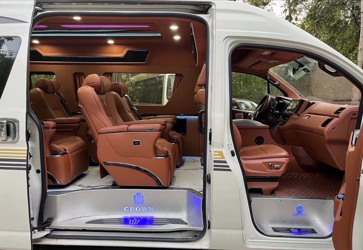 Toyota Hiace side-door view showing brown seats and entry step