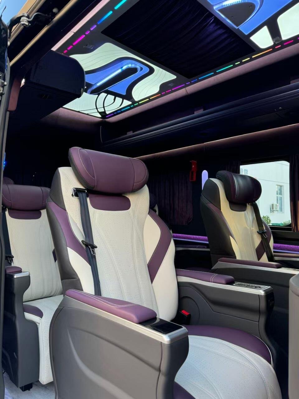 Cream and plum Transit passenger chair with controls on the seat base