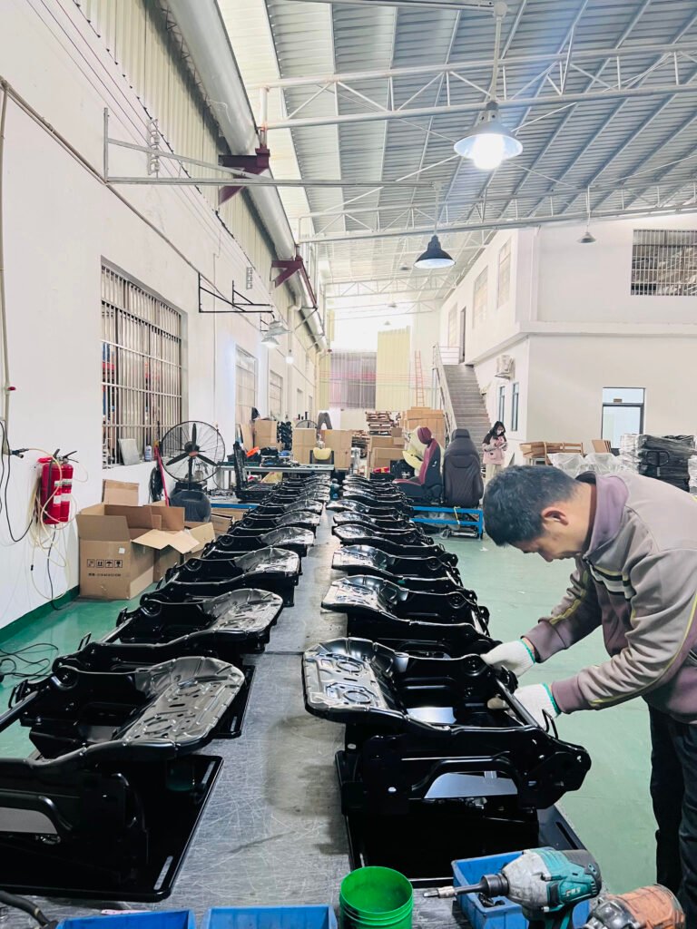 Seat frames arranged on a workshop assembly bench