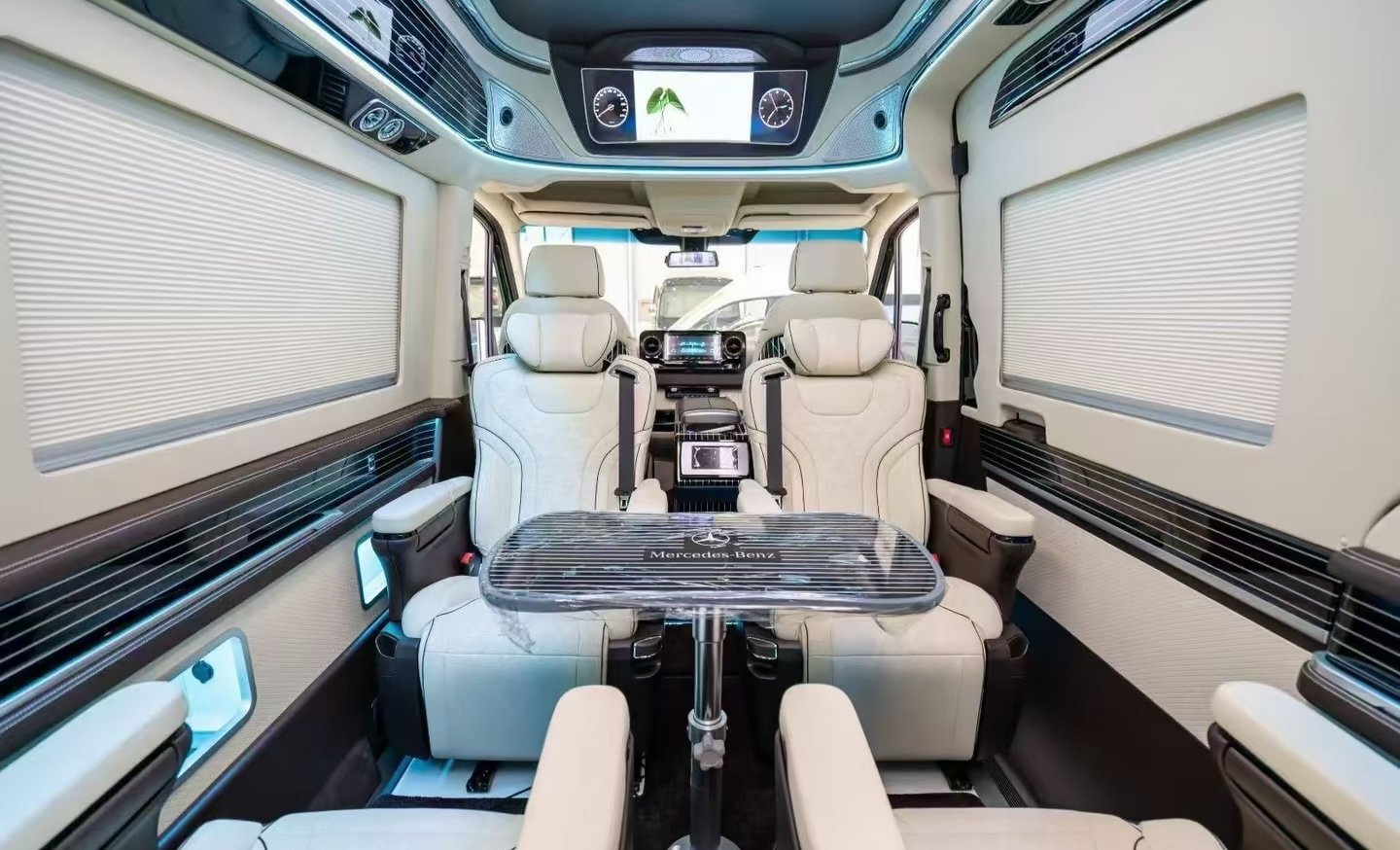 Facing passenger seats and central table — vehicle conversion reference