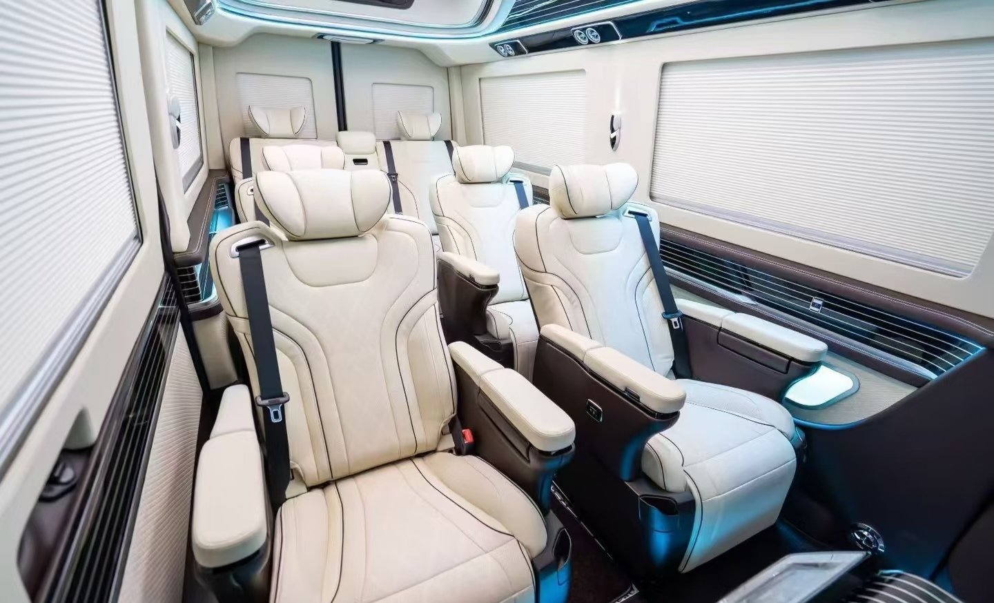 Cream individual passenger seats and rear bench — vehicle conversion reference