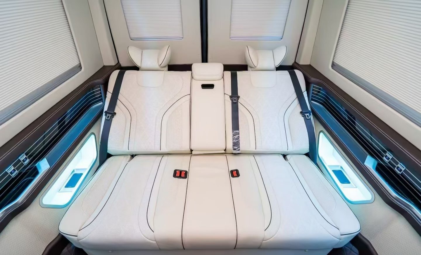 Cream rear bench and coordinated trim — vehicle conversion reference